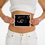 woman holding sonogram 1922245 Photo by Creatas Images on FreeImages scaled