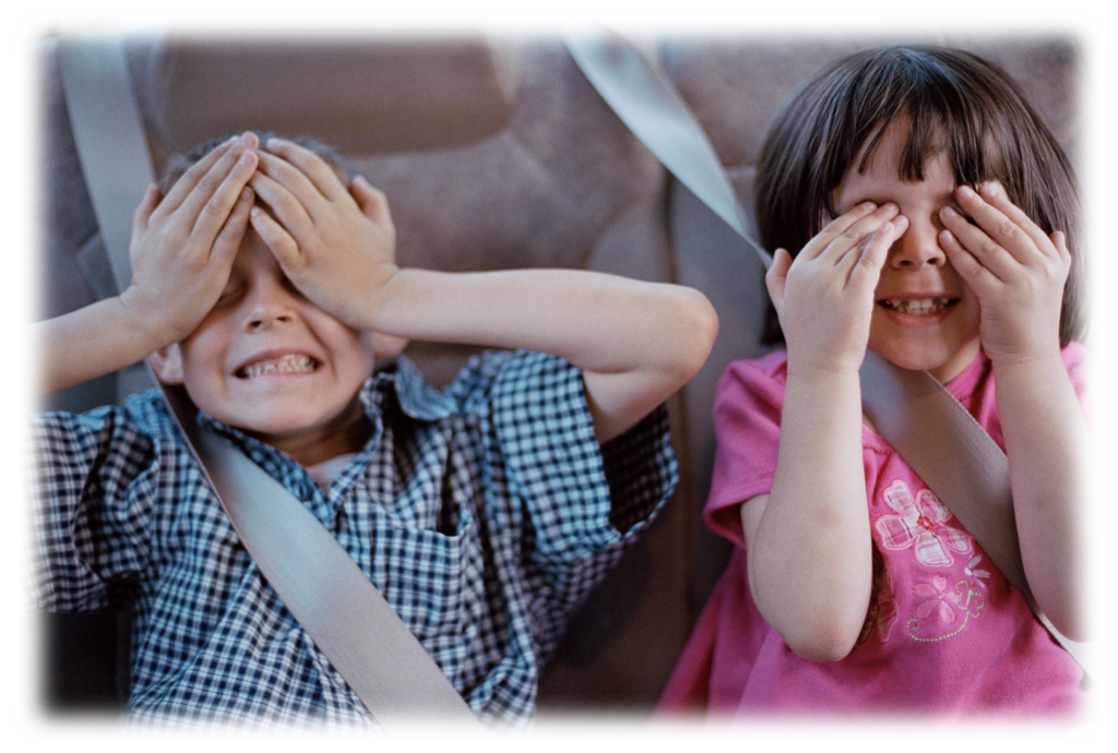 children covering their eyes in car 2263421 Photo by Polka Dot Images on FreeImages edited.jpg